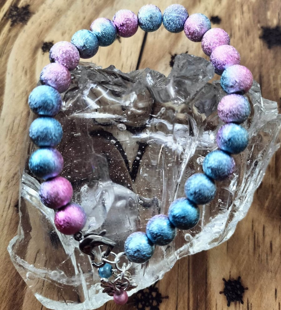 Pink and blue stardust miracle bead bracelet with a bee and heart clasp