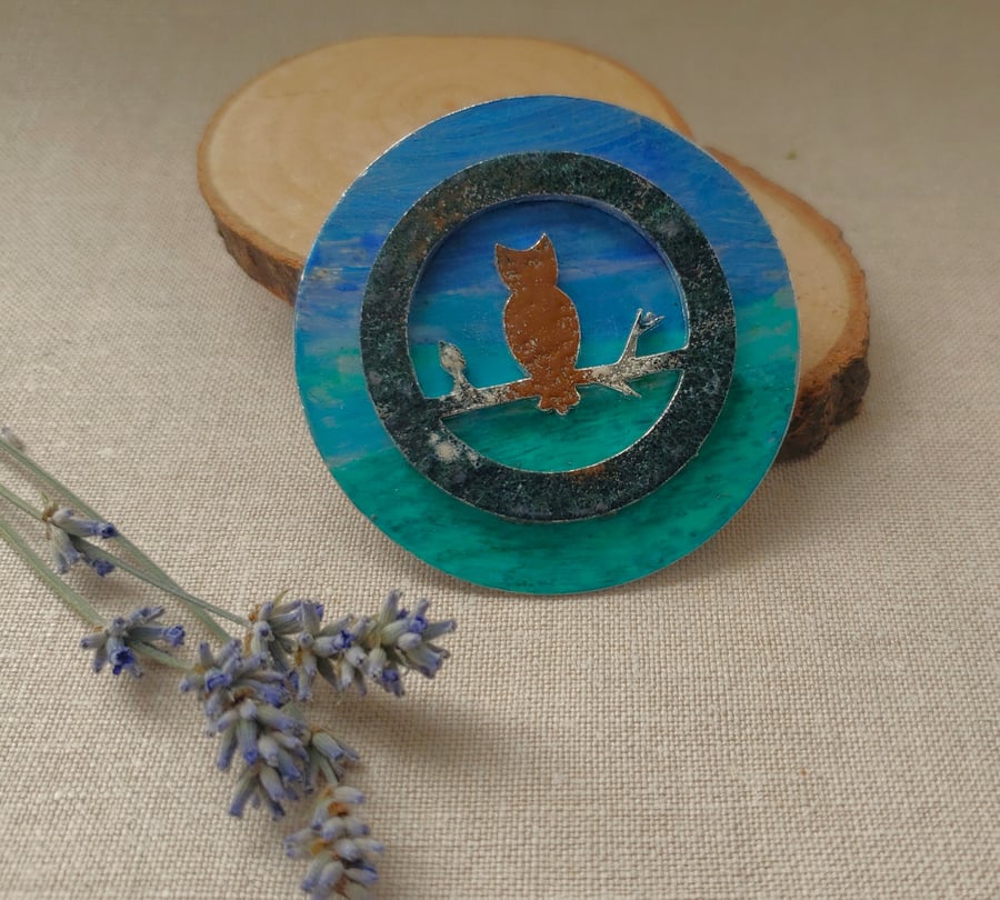 Enamel owl in landscape brooch