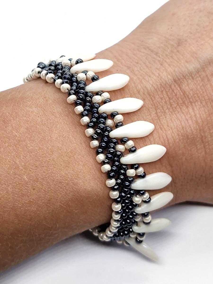 Haematite and dagger bead Grey and white tribal beadwork bracelet