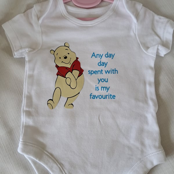 baby vest with Winny the Pooh pic and favourite day phrase
