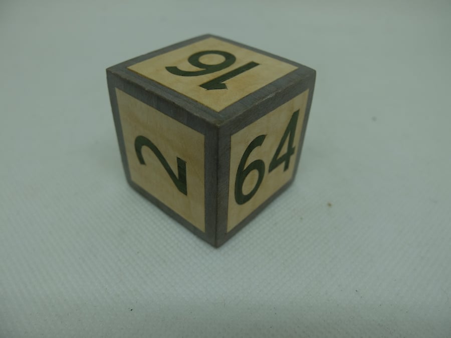 Backgammon doubling cube in veneered wood , grey edges, green numbers