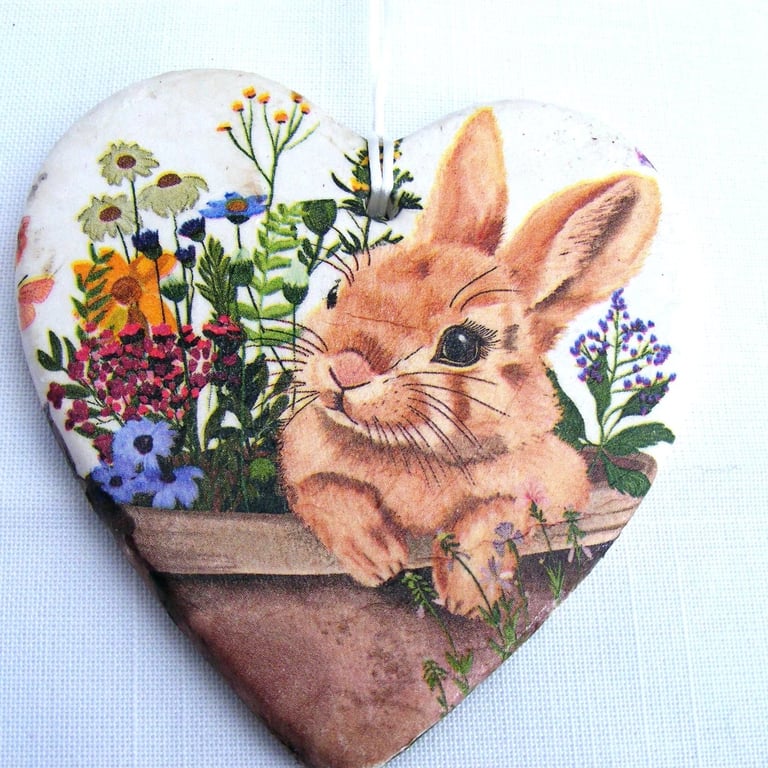 Decoupaged rabbit ceramic heart wall decoration.