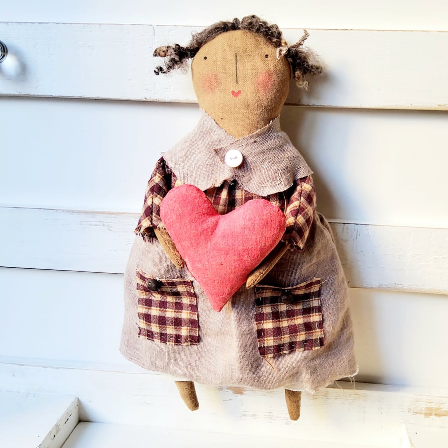 Sweet little primitive rag doll with heart