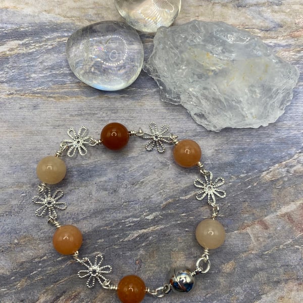 Orange aventurine rosary link bracelet with silver plated flower charms