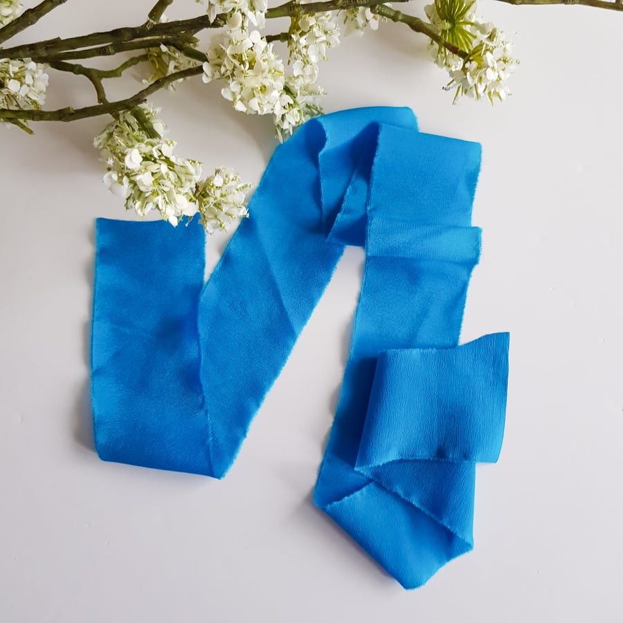 Hawaiian blue 100% silk crepe de chine ribbon with raw edge