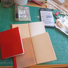 A6 notebook. Hemp paper fully bound in red nappa