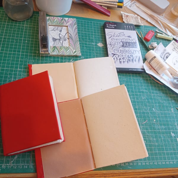 A6 notebook. Hemp paper fully bound in red nappa