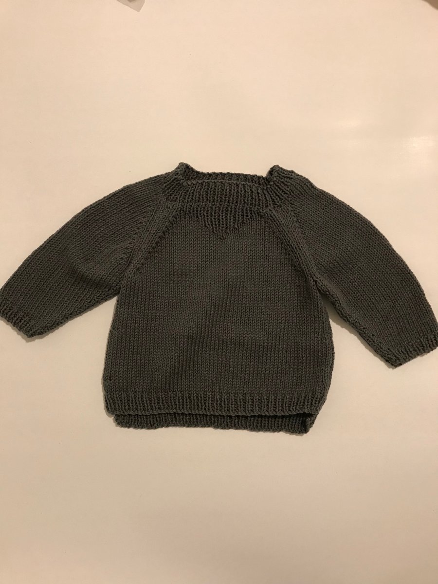 Hand knitted cotton baby jumper