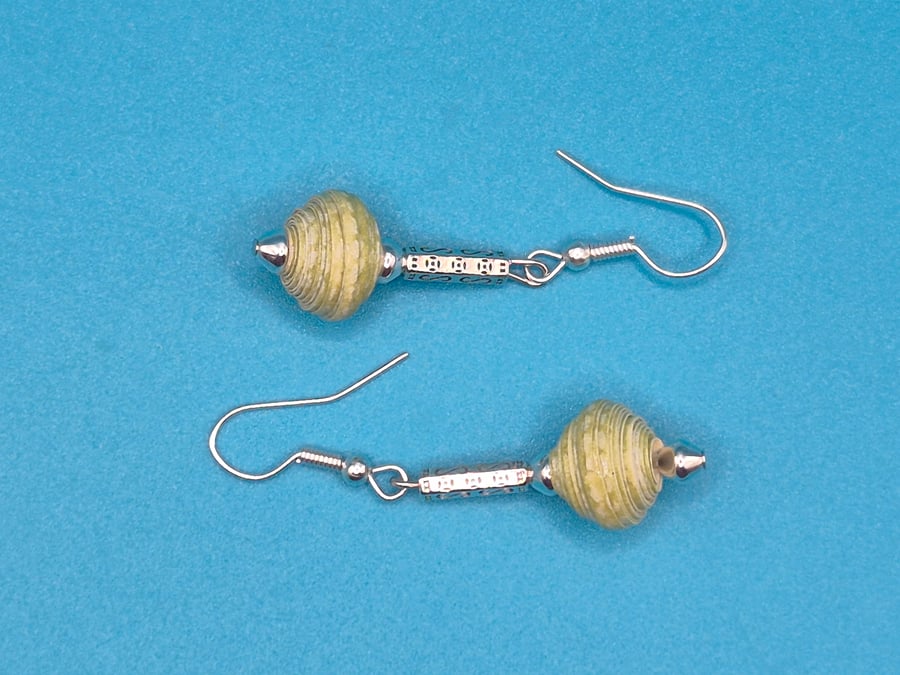 Paper beaded pale green earrings on an ornate metal rod