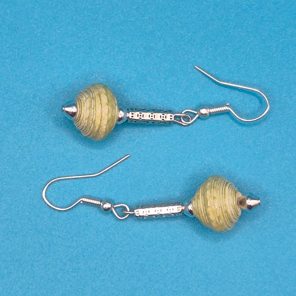 Paper beaded pale green earrings on an ornate metal rod