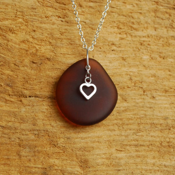 Brown beach glass pendant with silver heart