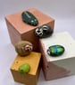 5 hand-painted pebble pets in a box - Image 1