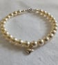 Pearl Bracelet with Puffed Heart Charm - Image 1