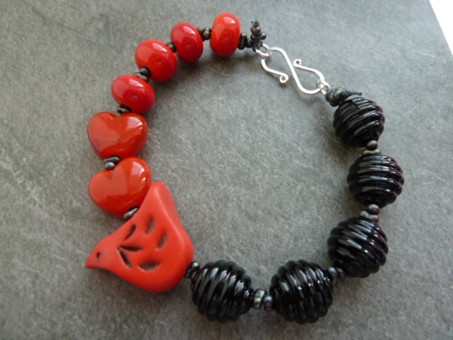 red and black lampwork bird bracelet
