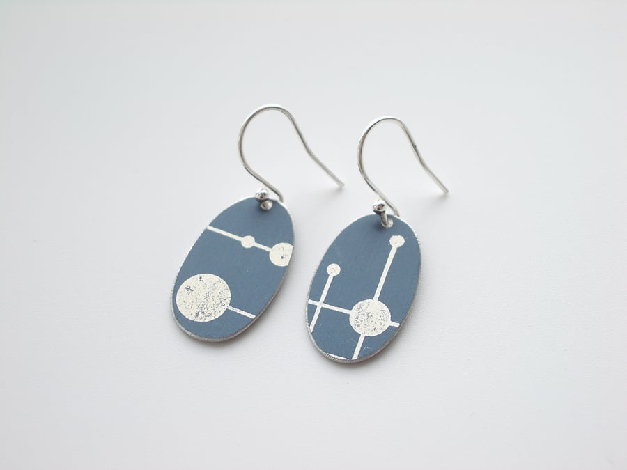 Black oval earrings with mid century print