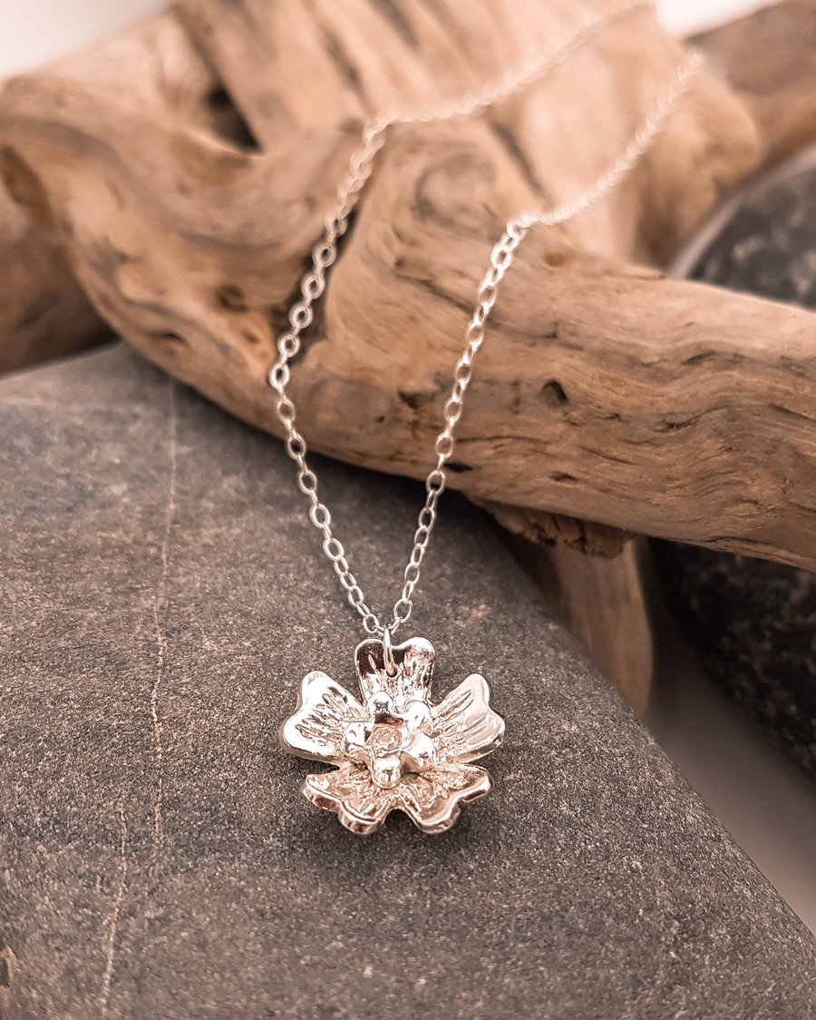 Fine silver flower pendant with Cubic Zirconia on a sterling silver chain