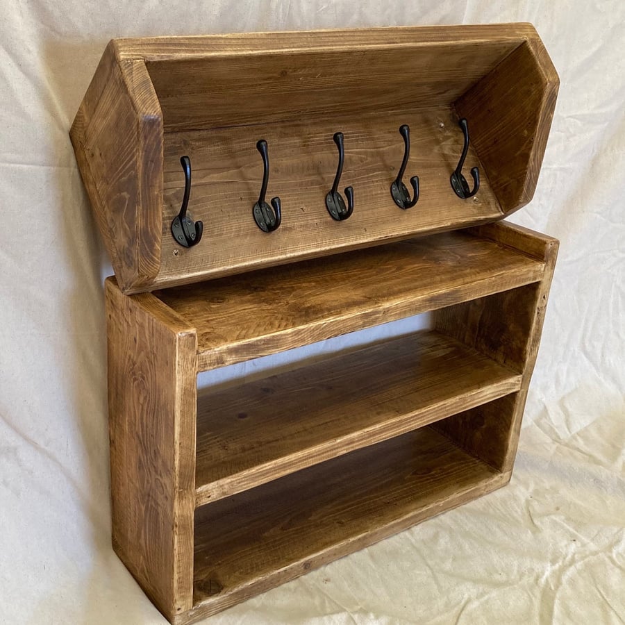 Reclaimed wood coat rack and shoe rack.