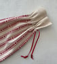 Scandi Style Red and White Drawstring Bottle Bag - Image 7