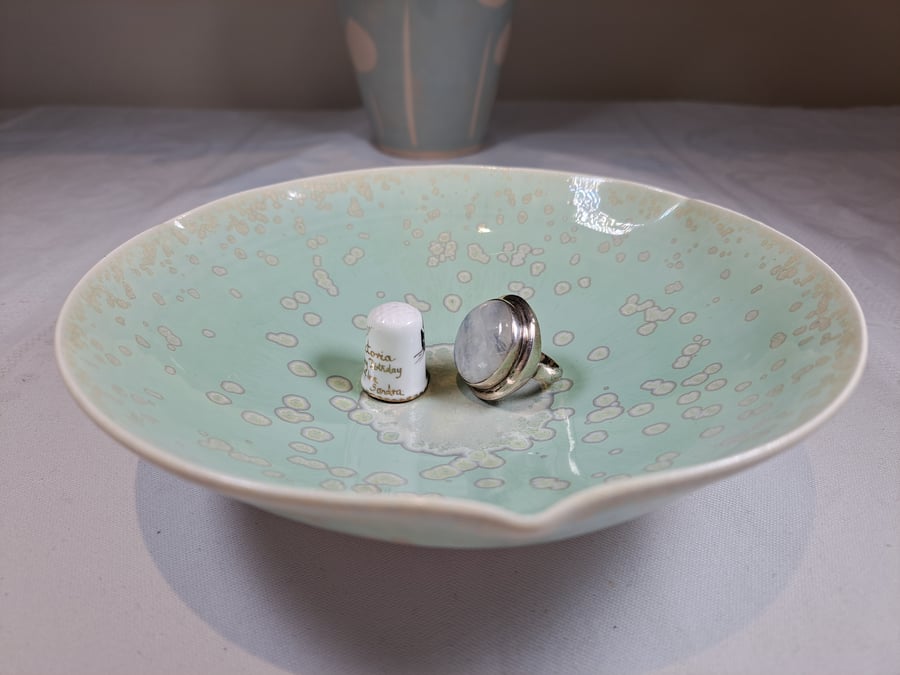 A hand thrown green turquoise porcelain stoneware trinket dish plate