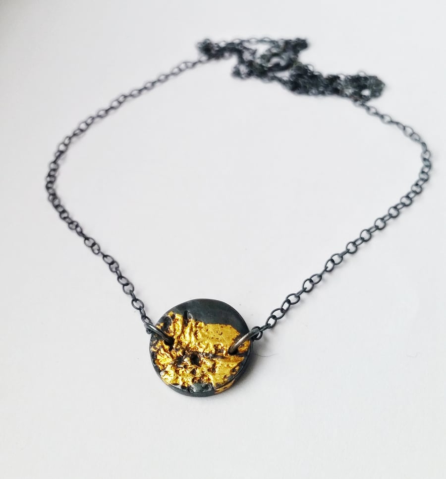 Unusual black and gold silver nature inspired necklace