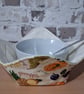 REVERSABLE BOWL COSY IN COLOURFUL FRUIT AND CREAM FABRIC