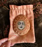  Painted pebble, serene meditation face, with vintage crochet doily