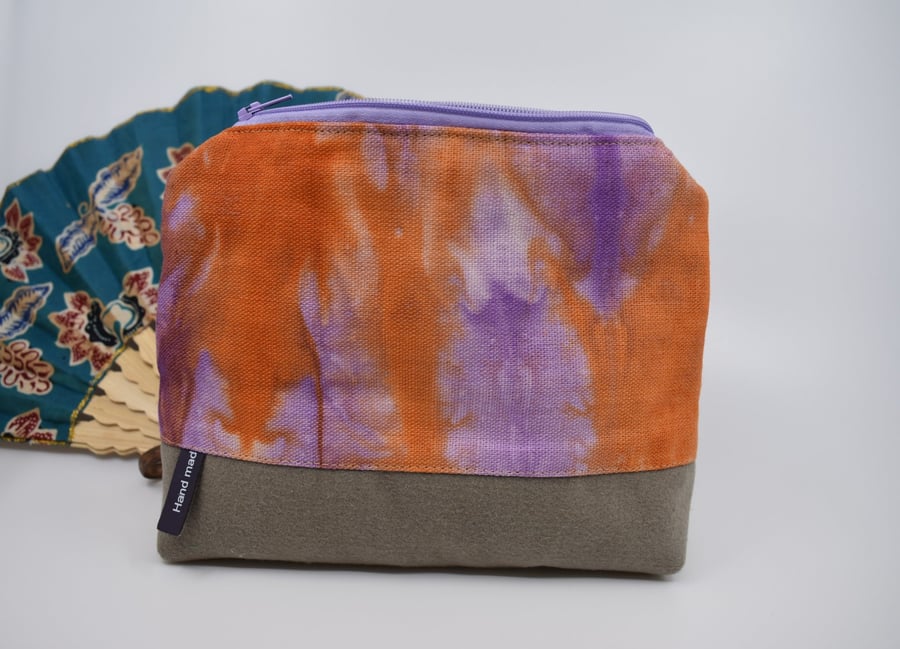 Attractive hand dyed linen and brushed cotton purse with a top zip. Fully lined