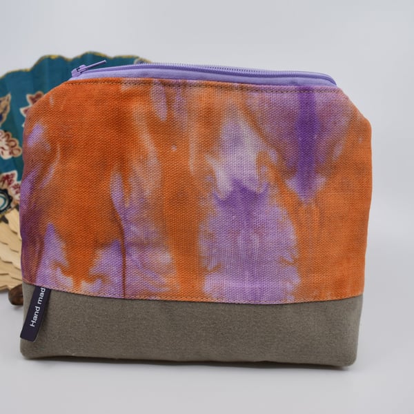 Attractive hand dyed linen and brushed cotton purse with a top zip. Fully lined