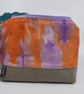 Attractive hand dyed linen and brushed cotton purse with a top zip. Fully lined