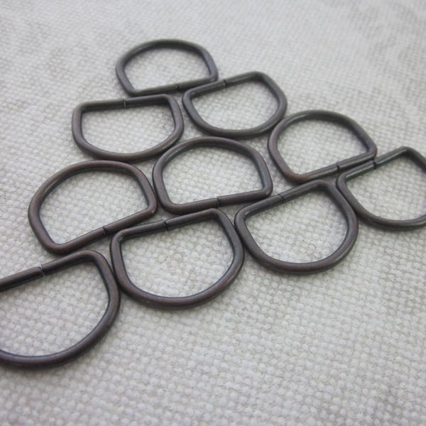10 Small Bronze Tone D Rings