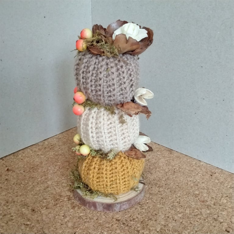 Crochet stacking pumpkins on a log base. Autumn decoration 
