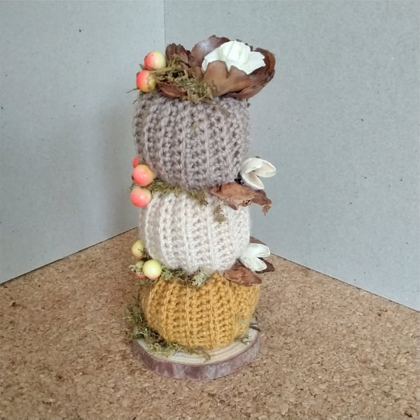 Crochet stacking pumpkins on a log base. Autumn decoration 