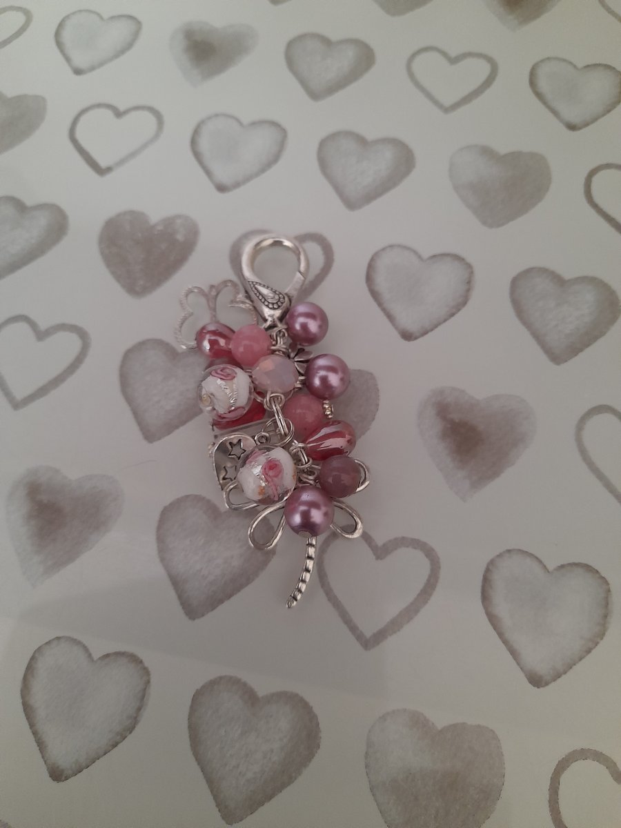 SHADES OF PINK AND SILVER FLORAL DRAGON FLY BAG CHARM.