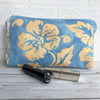 SALE - Cosmetic bag, make up bag in blue with golden yellow floral pattern
