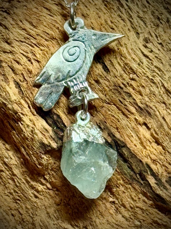 Silver raven and aquamarine gemstone pendant 