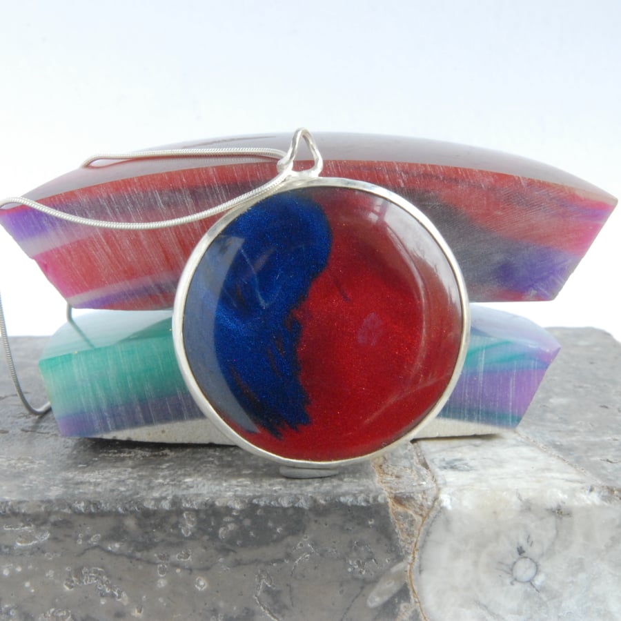 red and blue bowlerite pendant