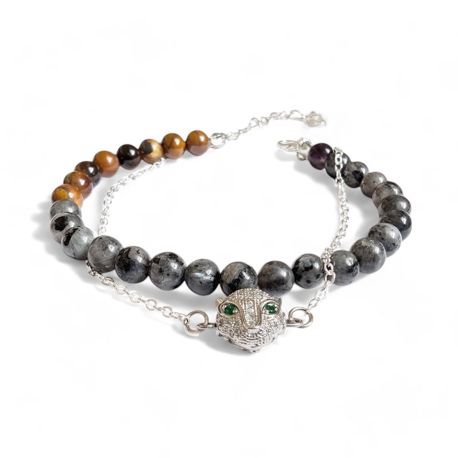Black lava stones necklace with gold spacer beads and a black and gold pedant.  