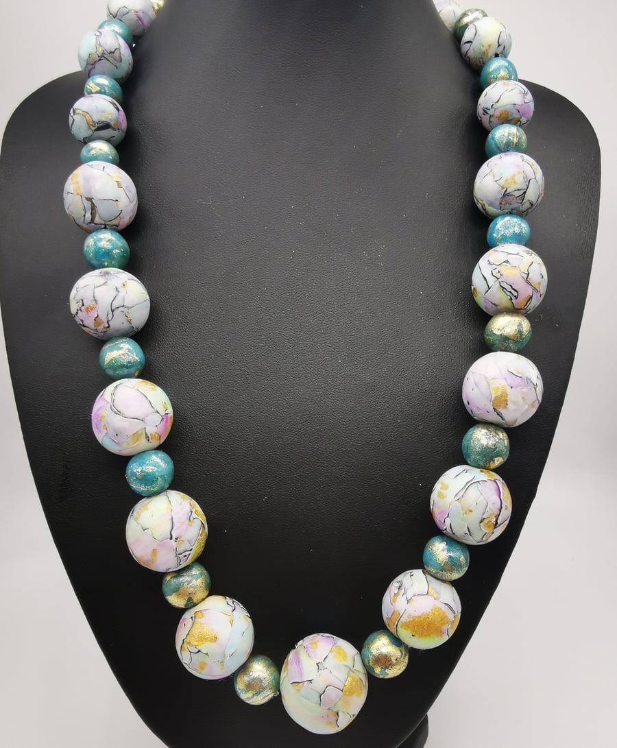 Cracked glaze effect statement necklace in aquatic tones