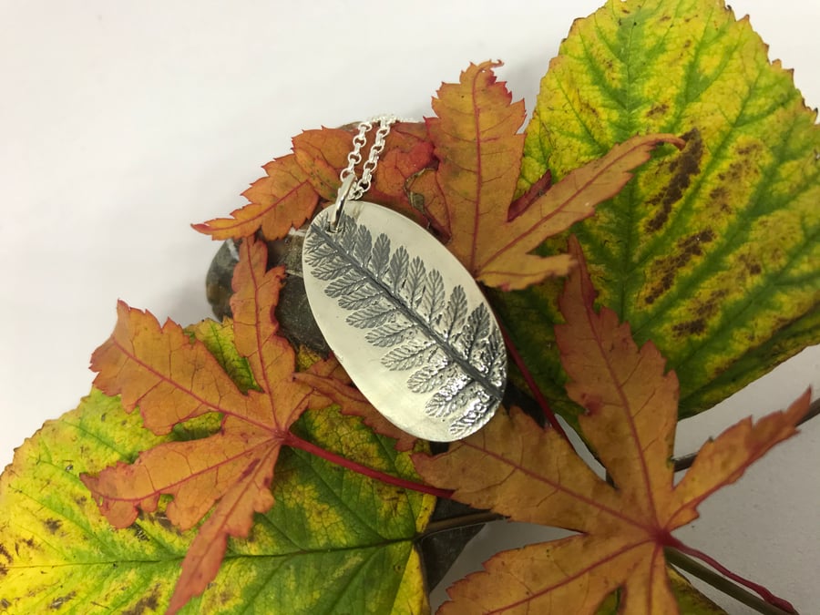 Silver fern imprint pendant