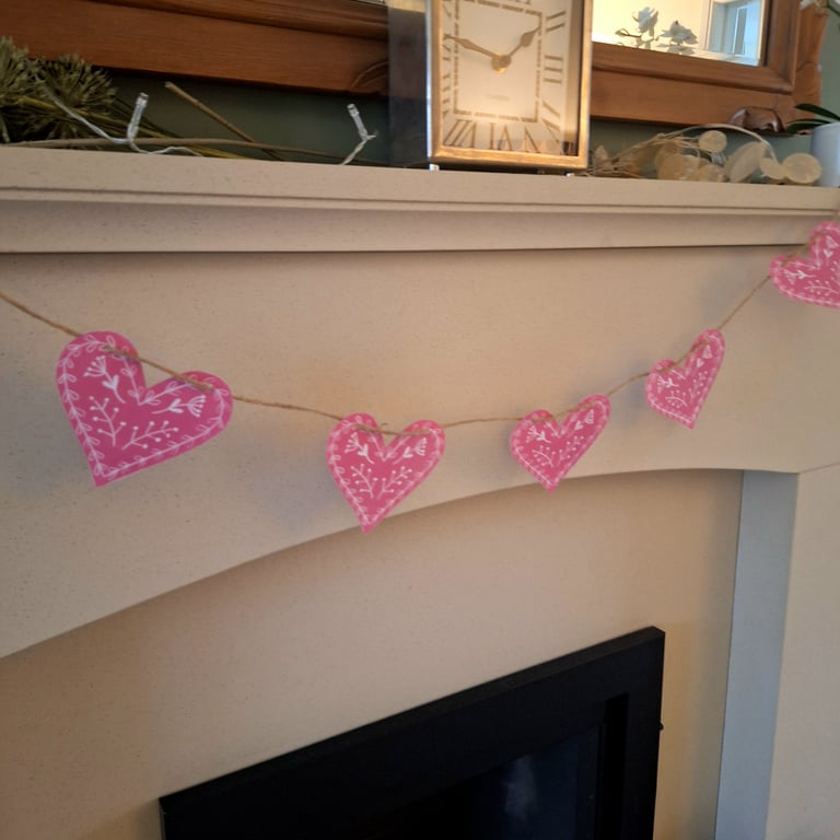 Linoprinted bunting featuring handprinted hearts.