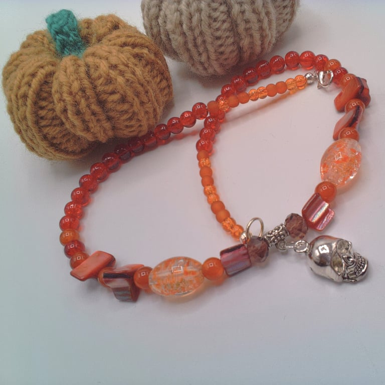 Silver Skull Pendant on an Orange Red Purple & Pink Shell Beaded Necklace