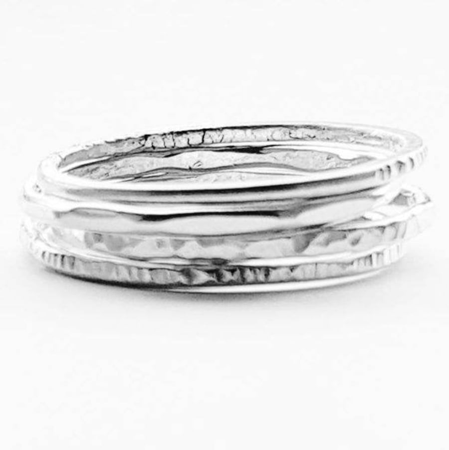 Four sterling silver stacking rings.