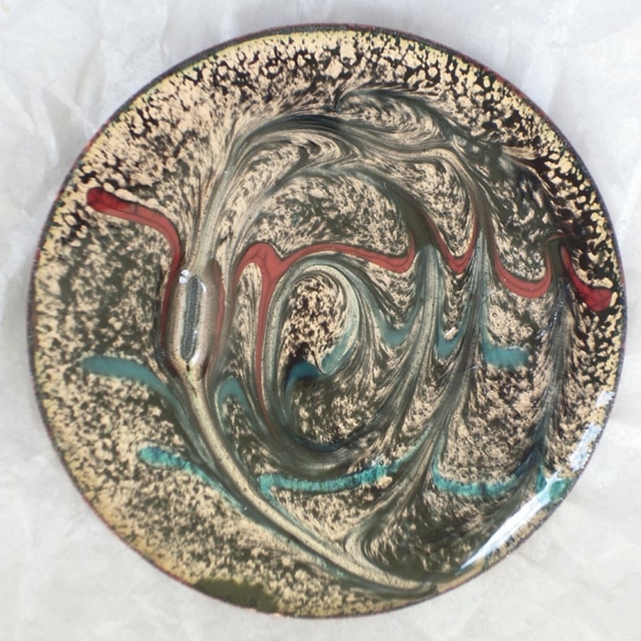 large round brooch - scrolled red and turquoise on black over clear enamel
