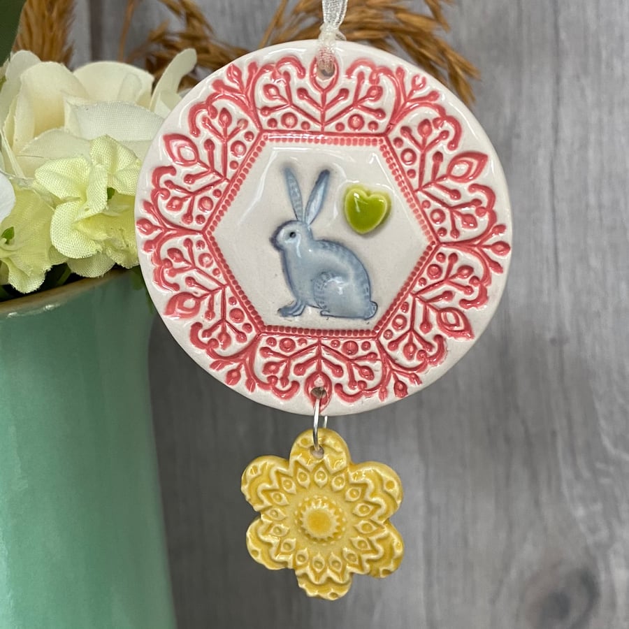 Ceramic decoration with rabbit and flower pink