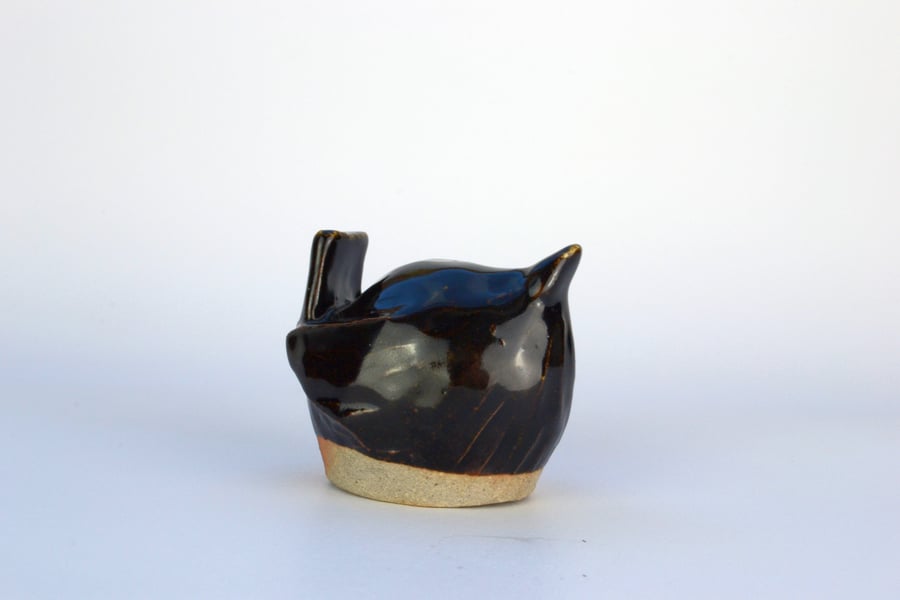 Shiny black ceramic wren