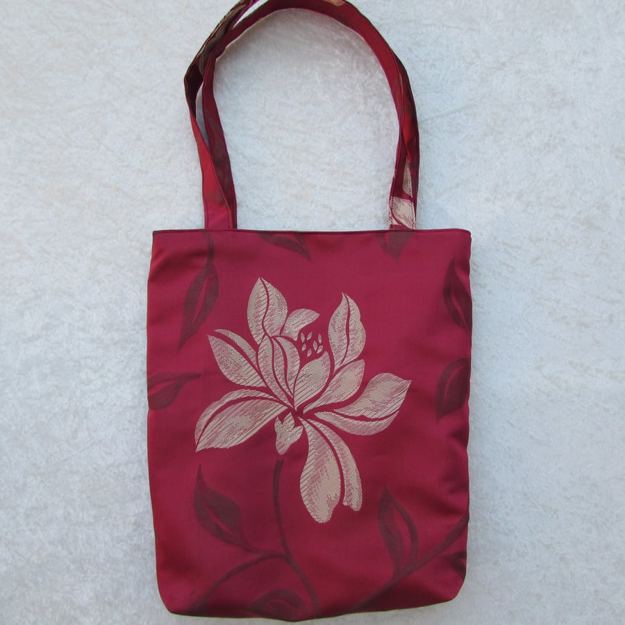 Dark red tote bag with large gold flower