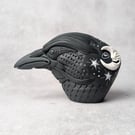'Astrum', a black porcelain crow idol.