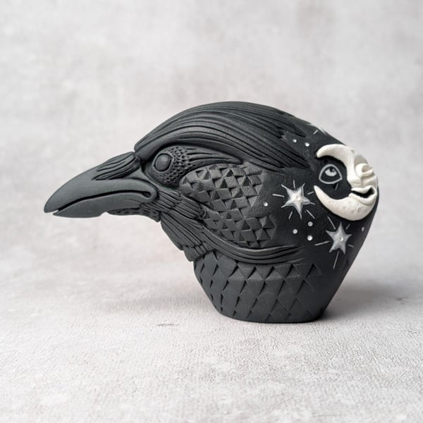 'Astrum', a black porcelain crow idol.