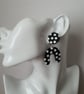 Retro Style Stud and Drop Wonky Arch Earrings in a Black and White Spot Pattern - Image 2
