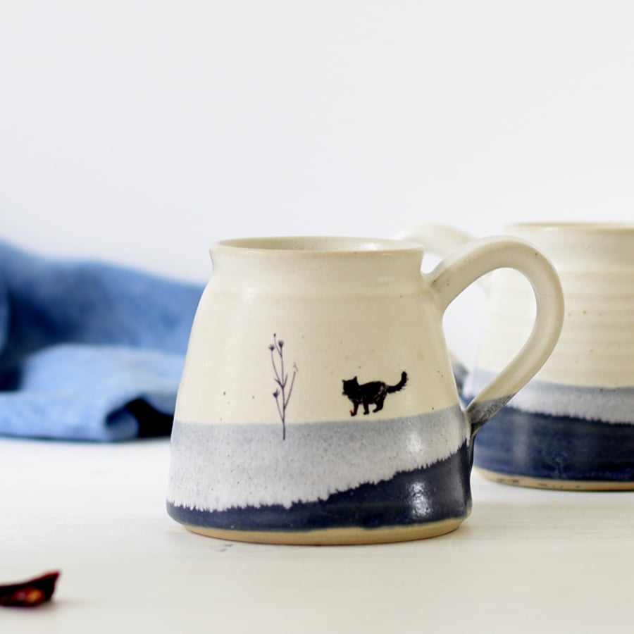 Handmade blue and white ceramic mug with cat image - stoneware pottery